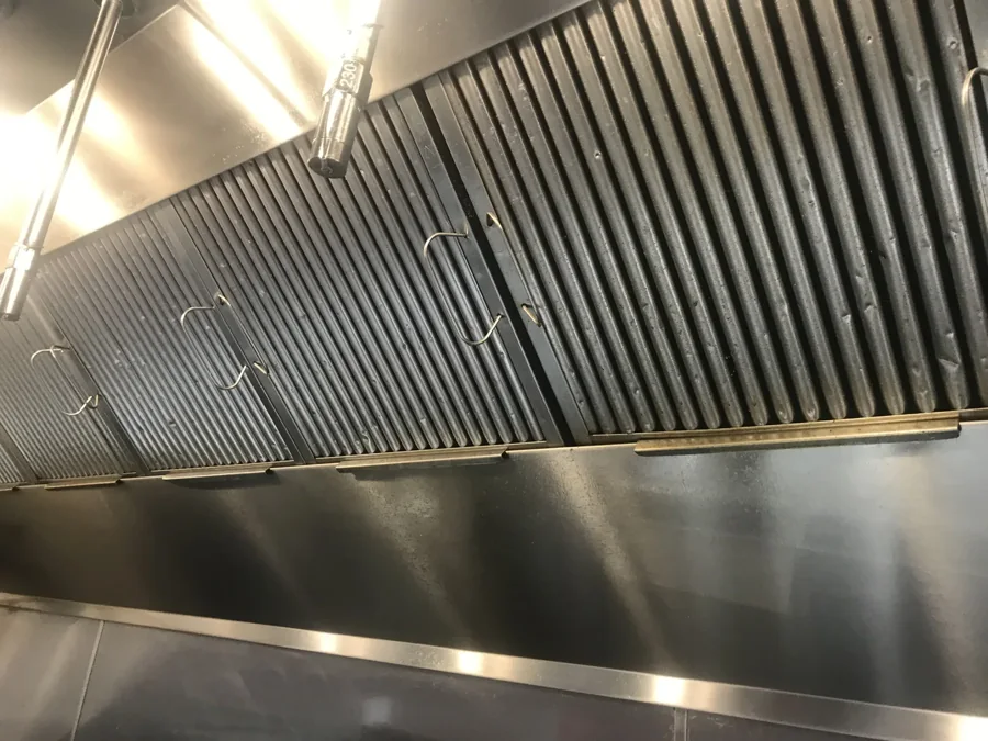 Clean stainless-steel hood and aligned baffle filters
